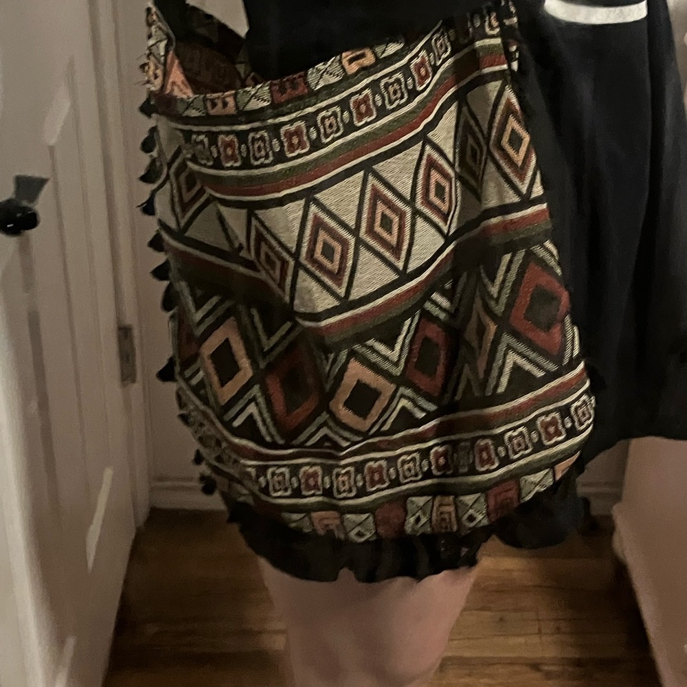 Dark multi colored bag, few pockets